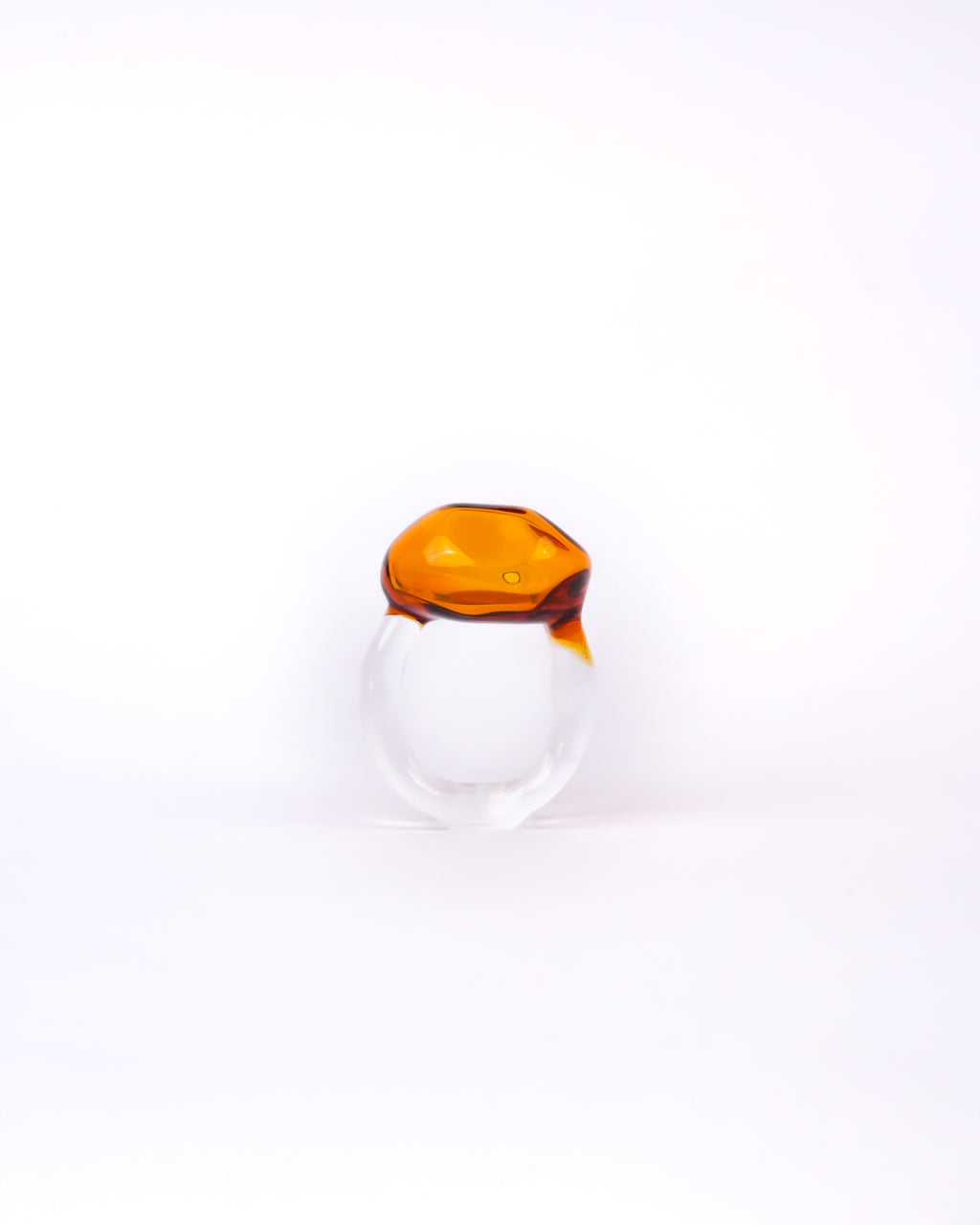 Handmade borosilicate glass ring in amber in amorphous shape by AIROKAD STUDIO.