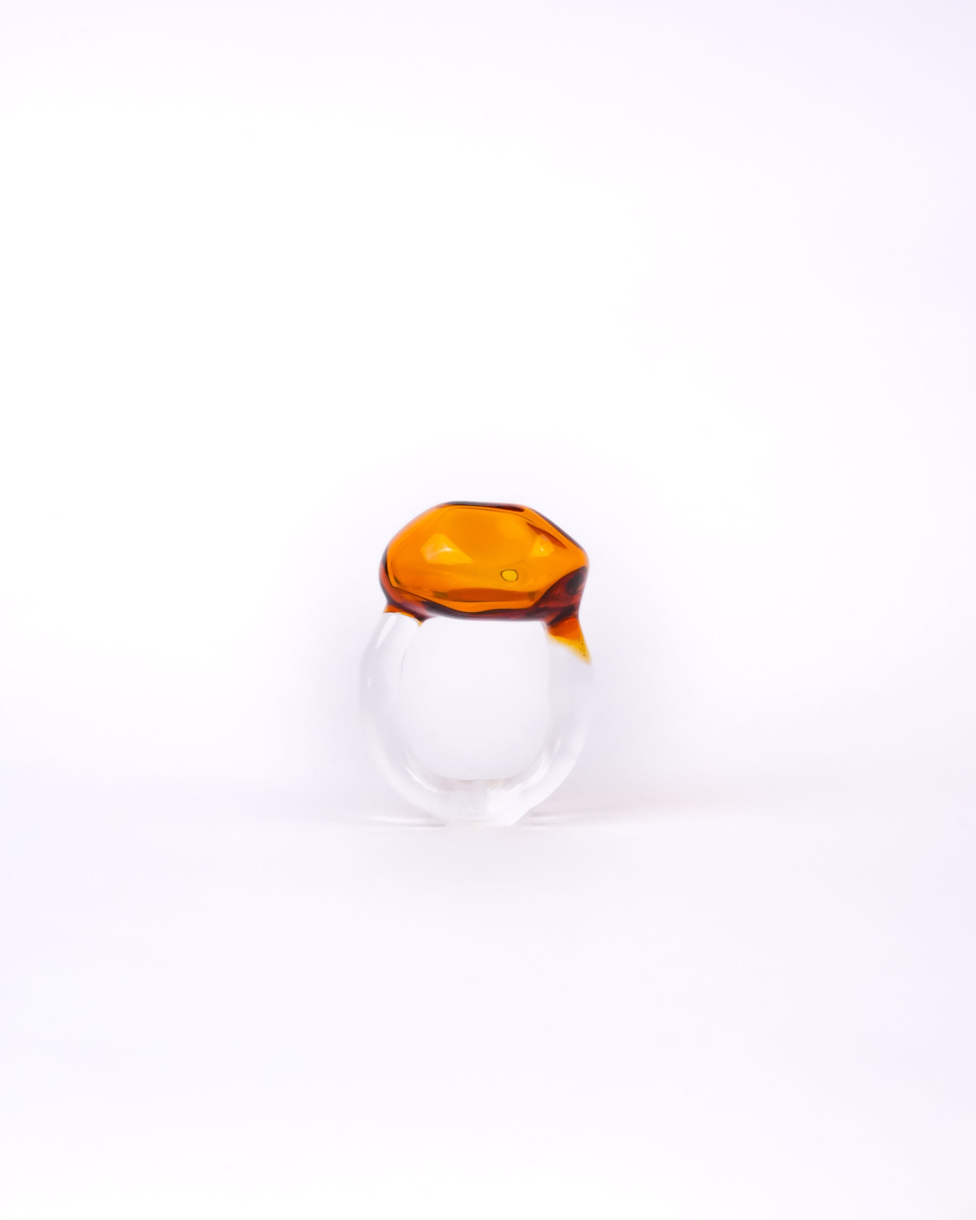 Handmade borosilicate glass ring in amber in amorphous shape by AIROKAD STUDIO.