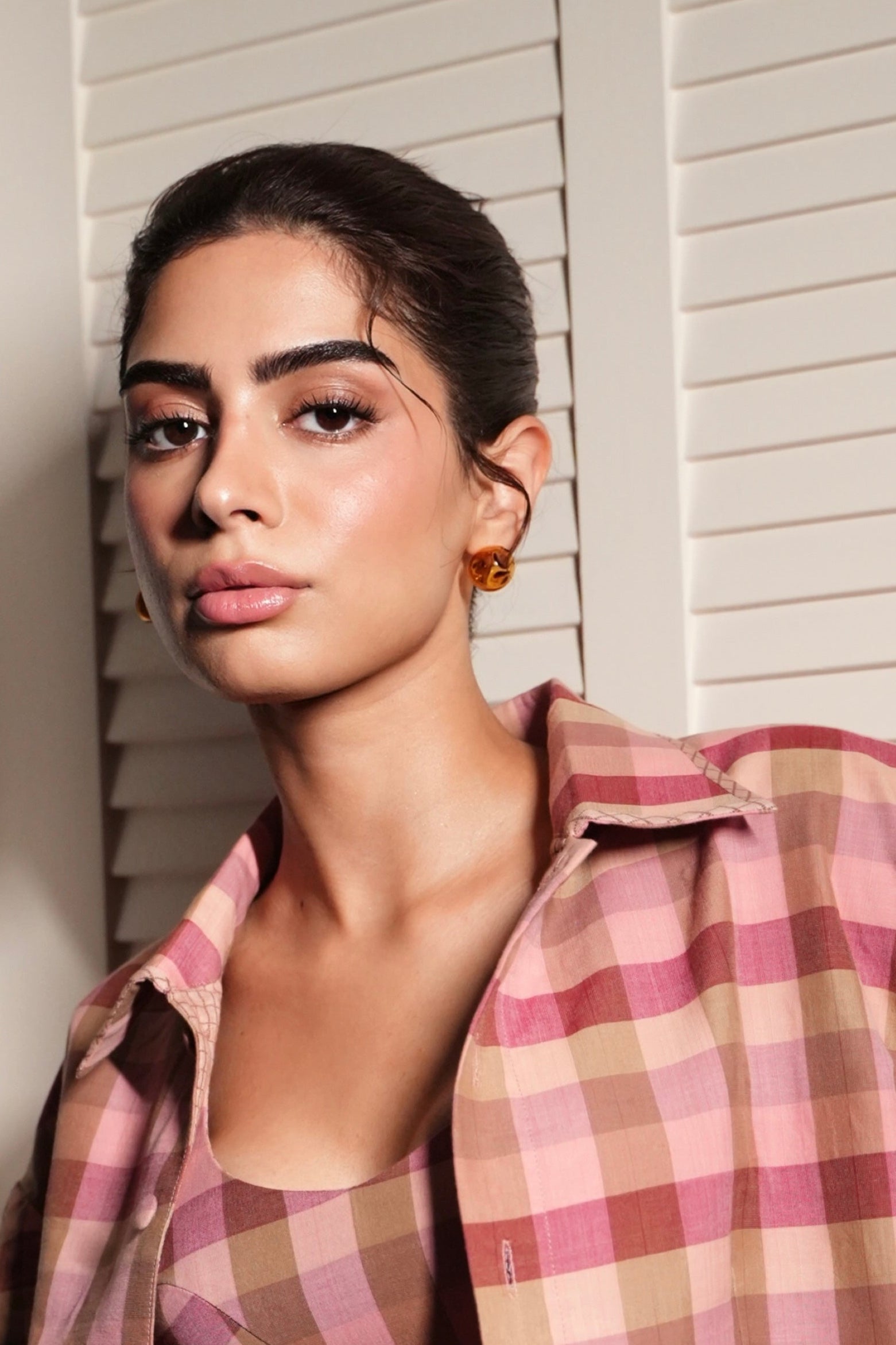 Khushi Kapoor in handmade borosilicate glass studs in amber by AIROKAD STUDIO. 