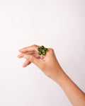 Model wearing blossom ring in green handcrafted with borosilicate glass by AIROKAD STUDIO