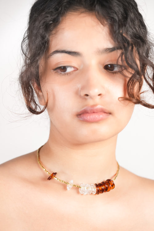 Model wearing handmade borosilicate glass beads choker in amber and clear by AIROKAD STUDIO