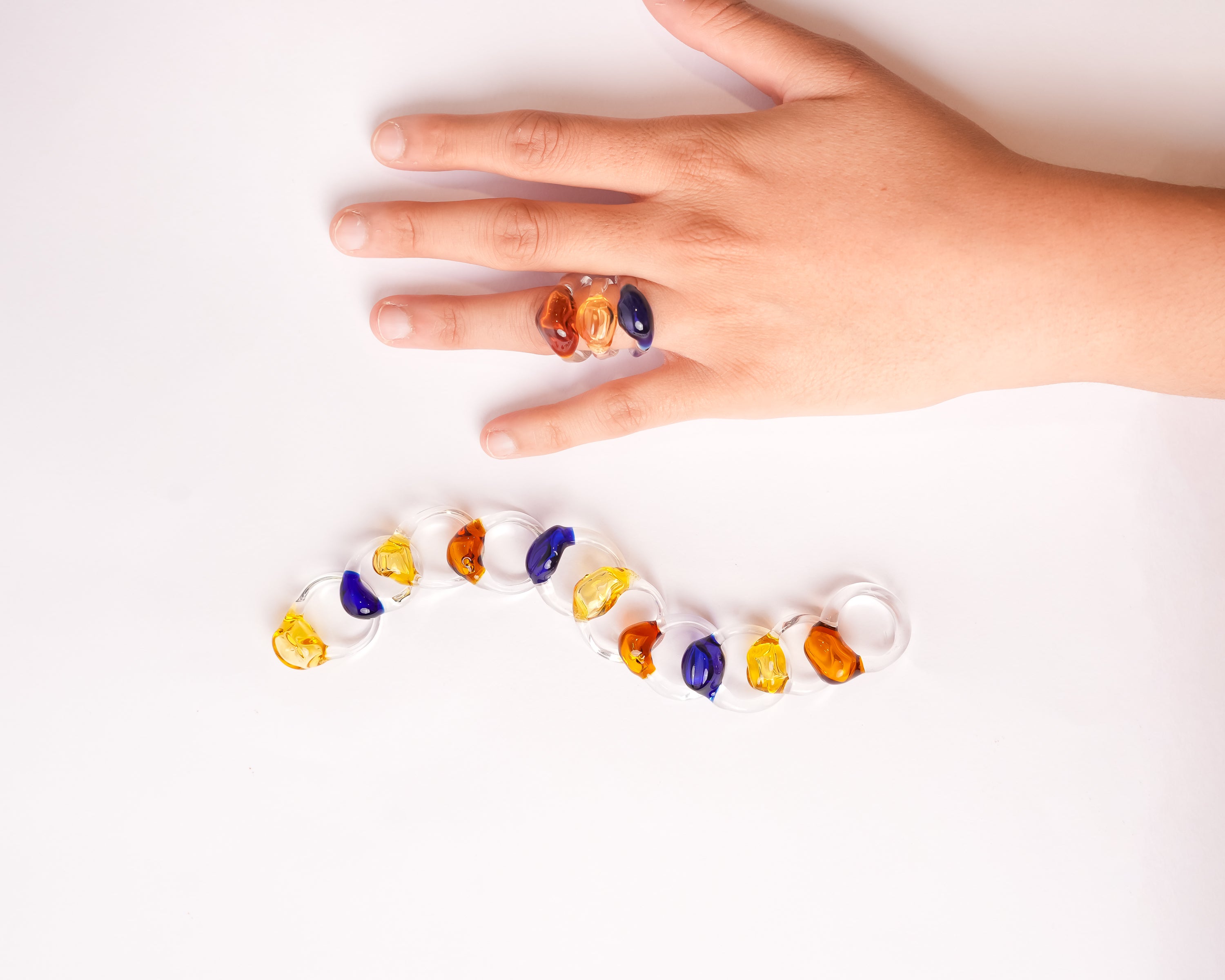 handcrafted glass rings in shades amber, blue and yellow by AIROKAD STUDIO. 