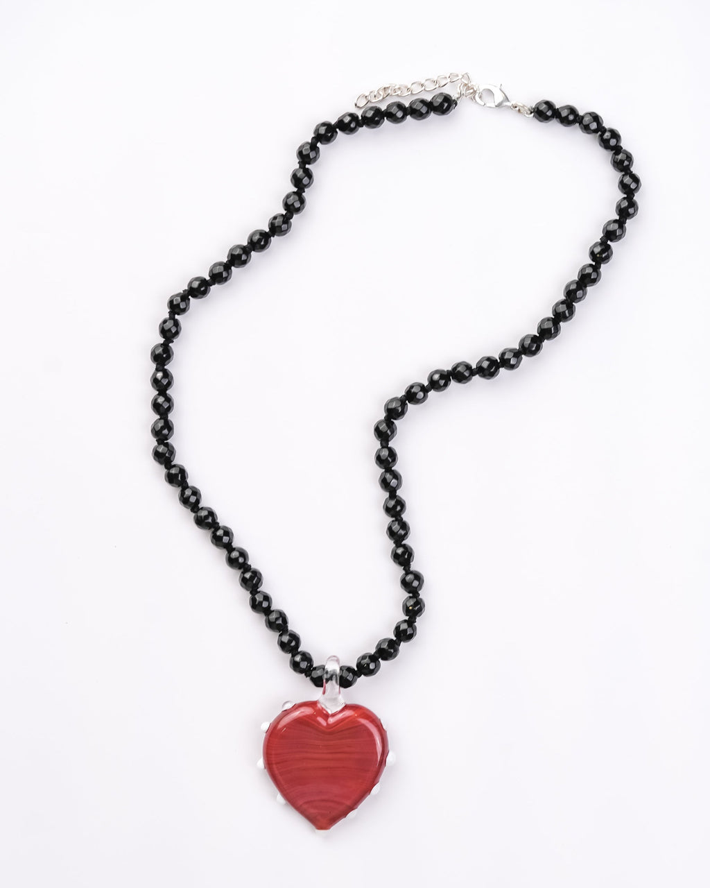 Handcrafted borosilicate glass necklace of red heart with white dot detailing and black beads by AIROKAD STUDIO.